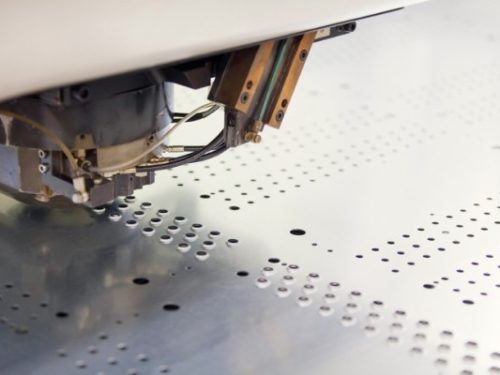 This is a photo of sheet metal going through the precision punching process