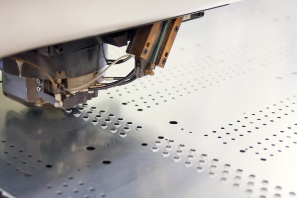 This is a photo of sheet metal going through the precision punching process