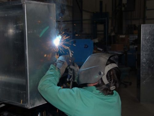 This is a photo of a person welding sheet metal
